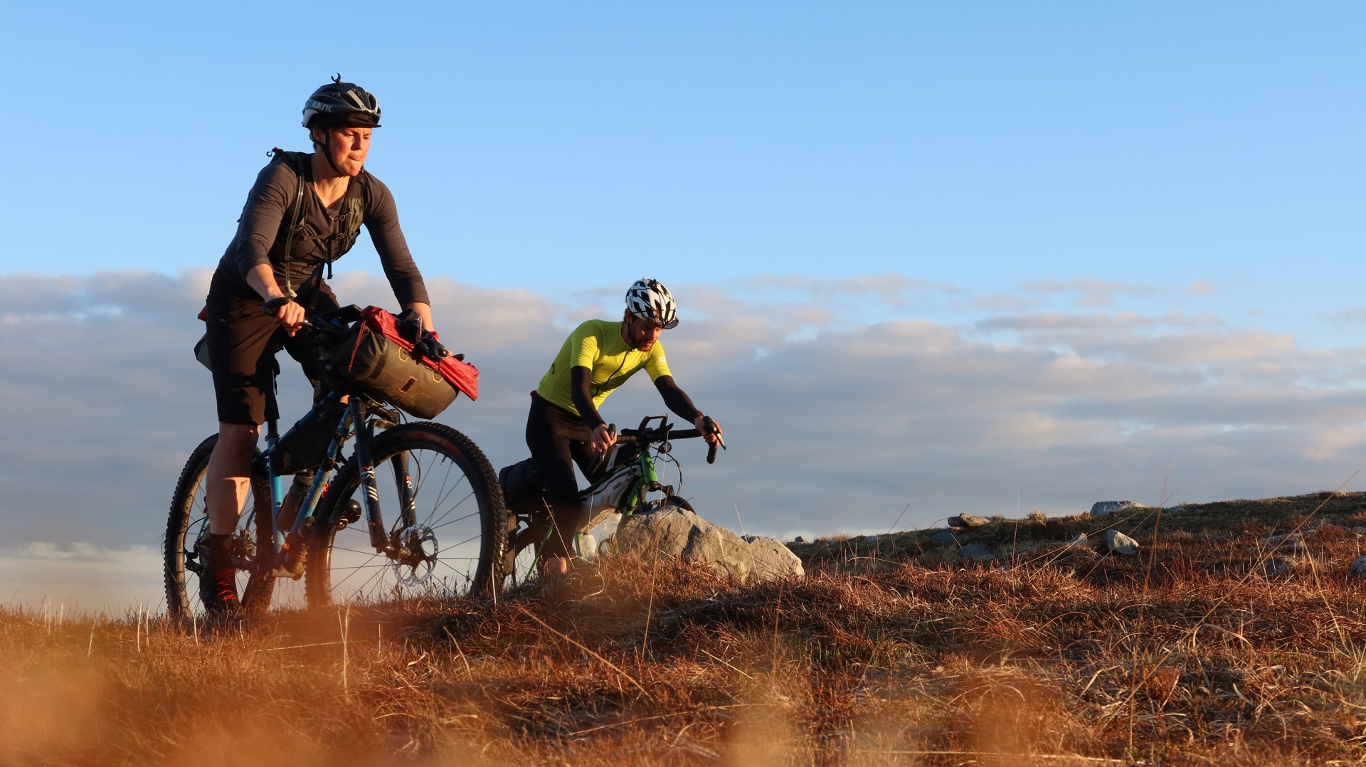 Background image - Cyclists in Argyll on landscape